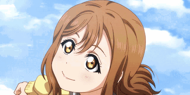 a close up of a girl 's face against a blue sky with clouds