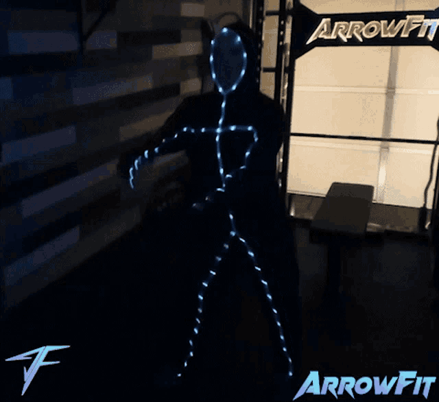 a person is standing in front of a sign that says arrowfit on it