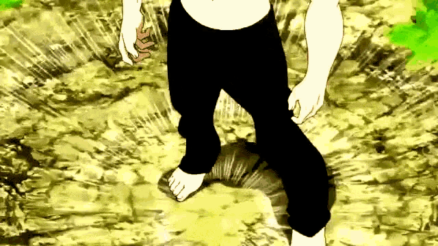 a man in black pants is walking barefoot on a rocky surface