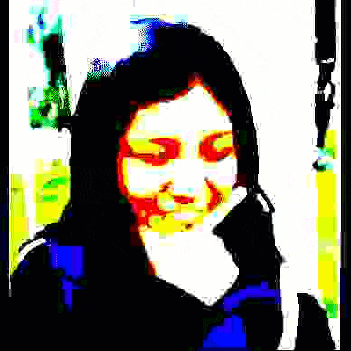 a woman is making a funny face with her hand on her chin in a blurry picture .