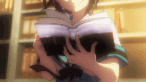a girl is reading a book in a library and the book is written in a foreign language