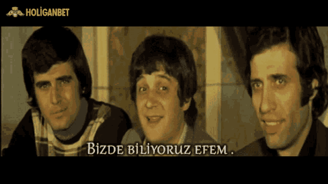 three men standing next to each other with the words bizde biliyoruz efem written below them