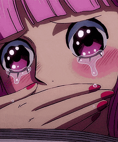a close up of a girl 's face with tears running down her face
