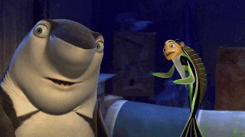 a shark and a fish are standing next to each other in a room
