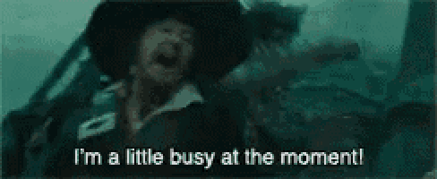 a man in a hat is saying `` i 'm a little busy at the moment! ''