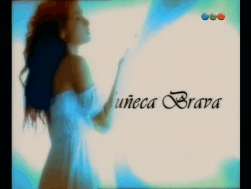 a woman in a white dress is standing in front of a sign that says unica brava