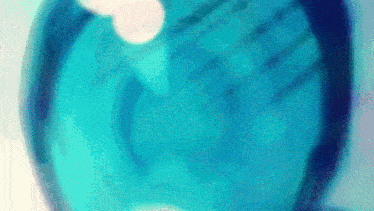 a blurred image of a blue sphere with a white circle in the middle