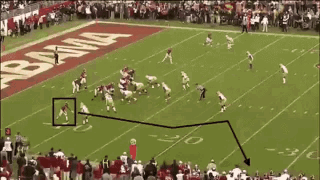 a football game is being played on a field with the word alabama on the side .