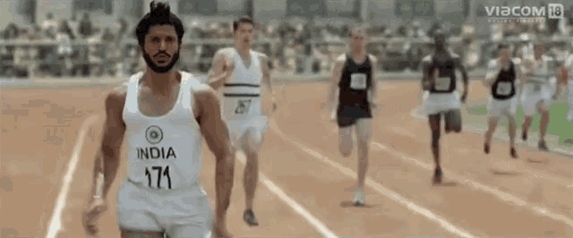 a man wearing a white tank top that says india 171