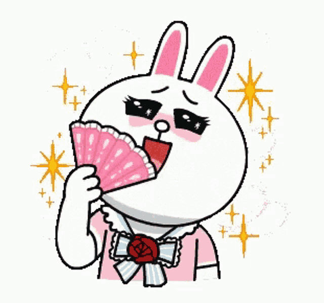 a cartoon bunny is holding a fan in her mouth .