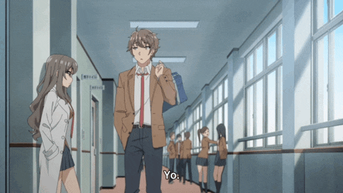 a man and a woman are walking down a hallway with yo written on the bottom right