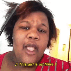 a woman is singing a song with the words `` this girl is on filiire '' .
