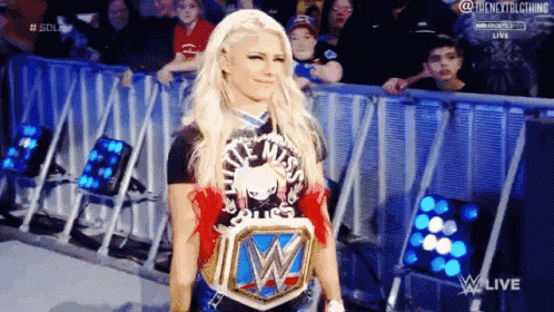 a female wrestler wearing a t-shirt that says little miss
