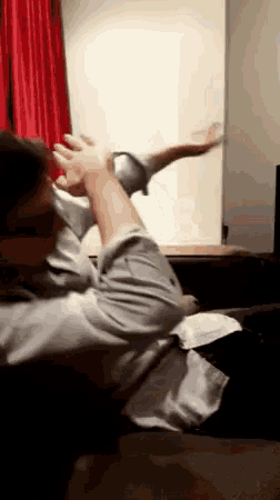 a man is sitting in a chair with his arm outstretched