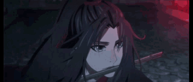 a close up of a person holding a flute with red eyes .