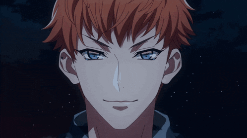 a blurry picture of a man 's face with red hair and blue eyes