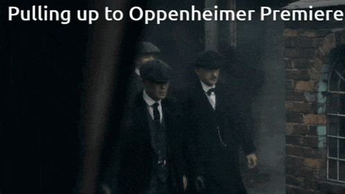 a group of men walking down a street with the words pulling up to oppenheimer premiere