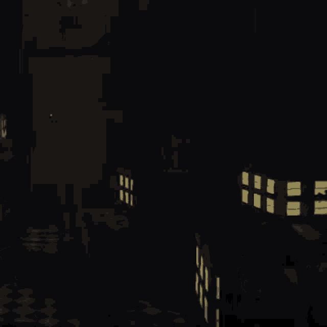 a creepy doll is laying on a checkered floor in the dark .