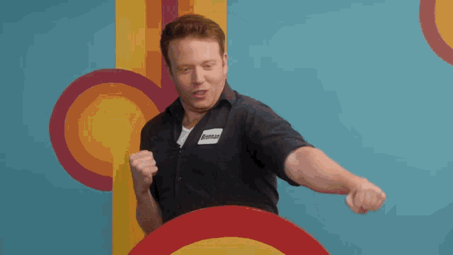 a man wearing a name tag that says dominoes