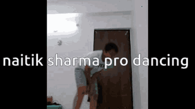 a man is dancing in front of a door with the words naitik sharma pro dancing written above him