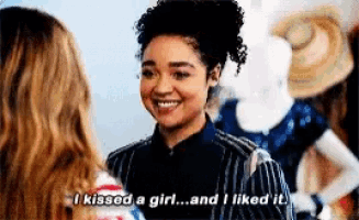 a woman is talking to another woman and says " i kissed a girl ... and i liked it "