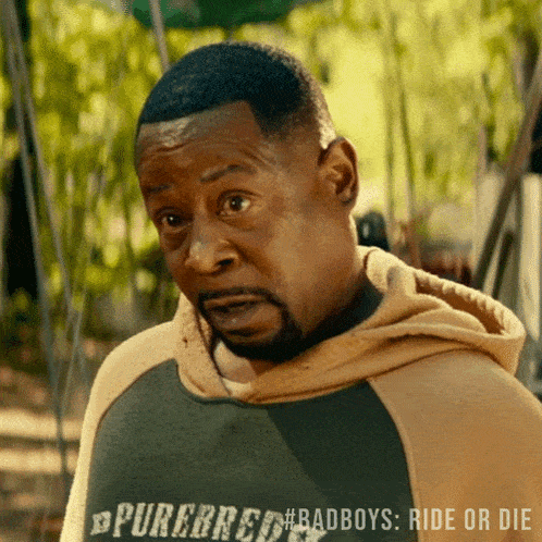 a man is wearing a shirt that says purebreed