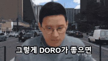 a pixelated image of a man with glasses and the words doro on the bottom right