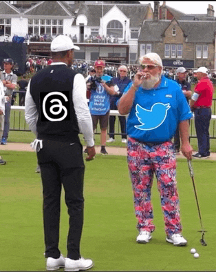 a man with a twitter logo on his shirt