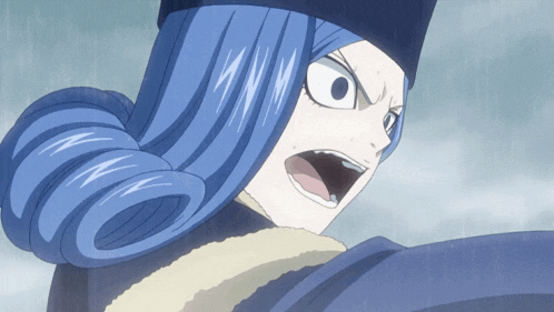 a close up of a person with blue hair making a funny face
