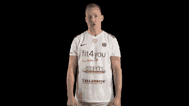 a man wearing a white jersey with fit4you written on it