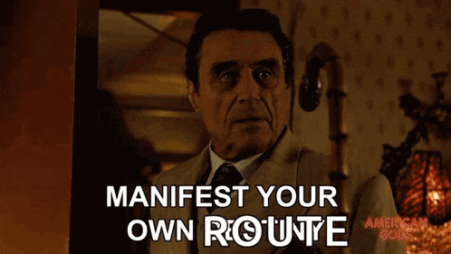 a man in a suit and tie says manifest your own route on a screen
