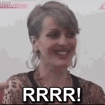 a woman is smiling and saying rrrr .