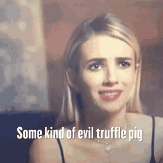 a woman is smiling with the words some kind of evil truffle pig above her