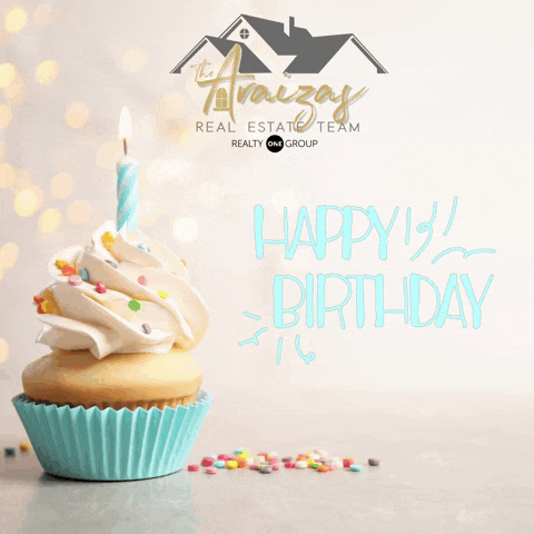 a cupcake with a lit candle and the words " happy 1st birthday " on it