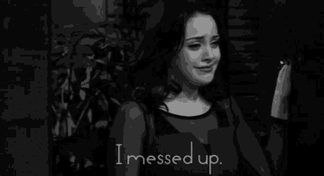 a woman is crying in a black and white photo with the words i messed up