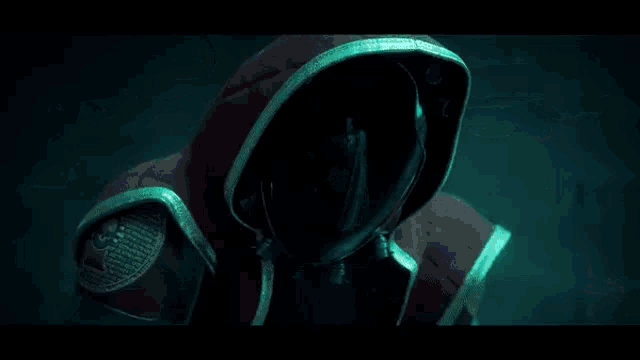 a robot is standing next to a man in a red robe .