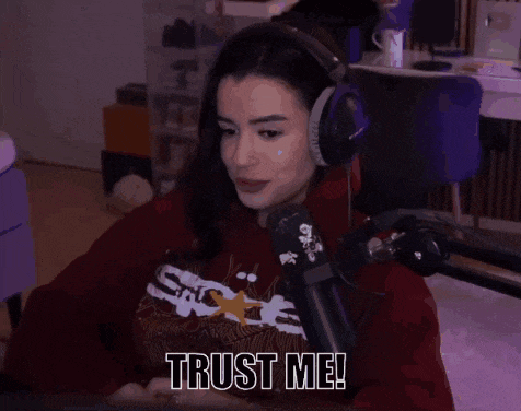 a woman wearing headphones and a red shirt says trust me