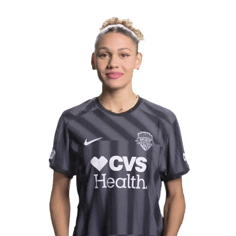 a woman wearing a cvs health shirt with her mouth open