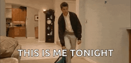 a man is walking through a living room carrying a suitcase and says `` this is me tonight '' .
