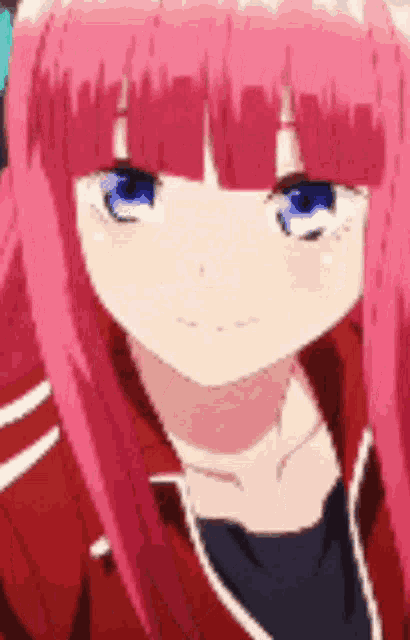 a close up of a pink haired anime girl with blue eyes and a red jacket .