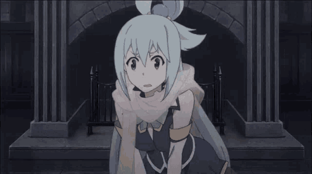 a girl with a scarf around her neck is making a surprised face .