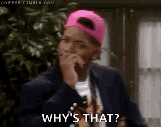 a man wearing a pink hat and a suit is asking why 's that ?