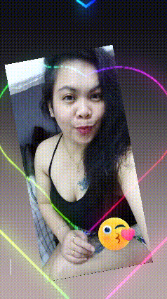 a woman in a black tank top is surrounded by rainbow colored hearts