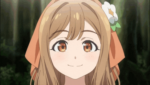 a girl with a flower in her hair is smiling