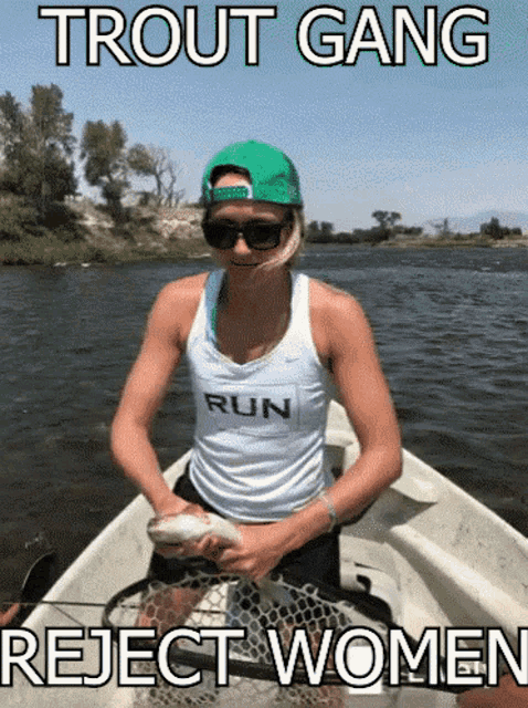 a woman in a boat holding a fish with the words trout gang reject women written above her