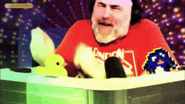 a man in a red london shirt is sitting in a hot tub