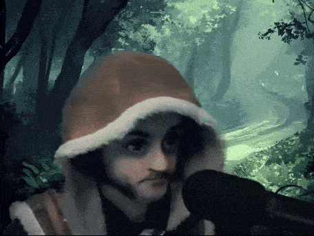 a man in a hooded jacket is talking into a microphone in the woods