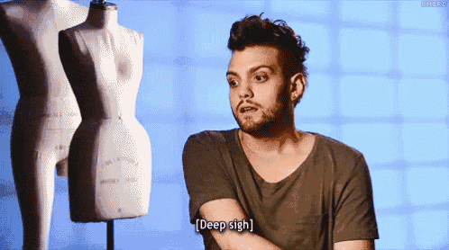a man with a beard says " deep sigh " while standing in front of a mannequin