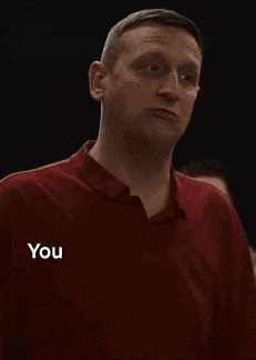 a man in a red shirt is saying that he can 't do anything when someone says shut up