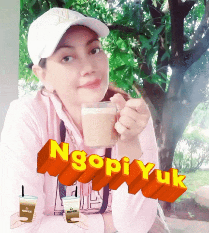a woman is holding a cup of coffee in front of a tree and the words ngopi yuk are behind her